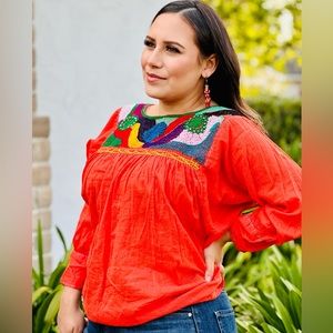 Mexican clothing. Orange top from the state of Oaxaca.